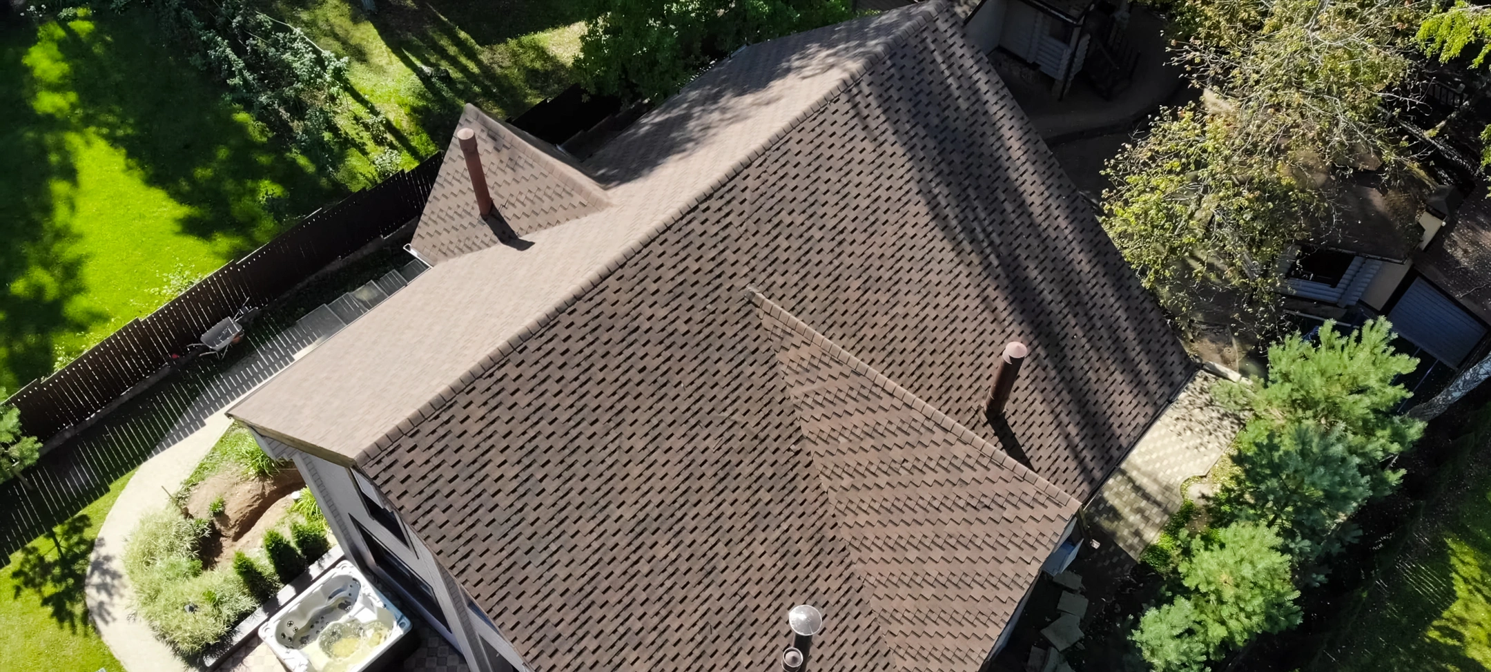 arial view of roof replacement with brown shingles