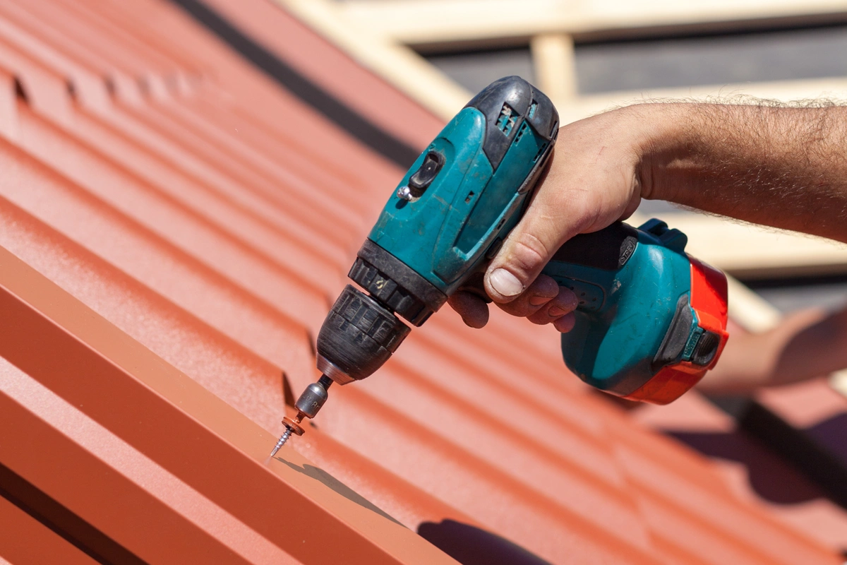 how to install a metal roof using drill to screw in metal panels