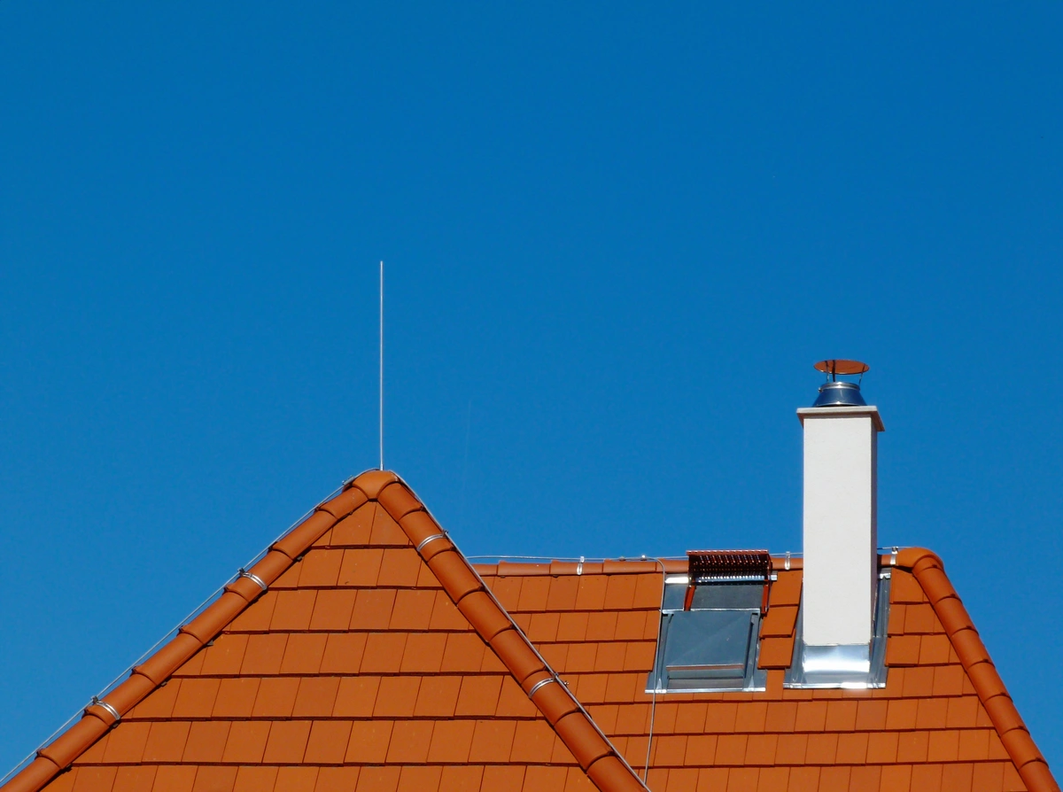 red tile roof with chimney flashing