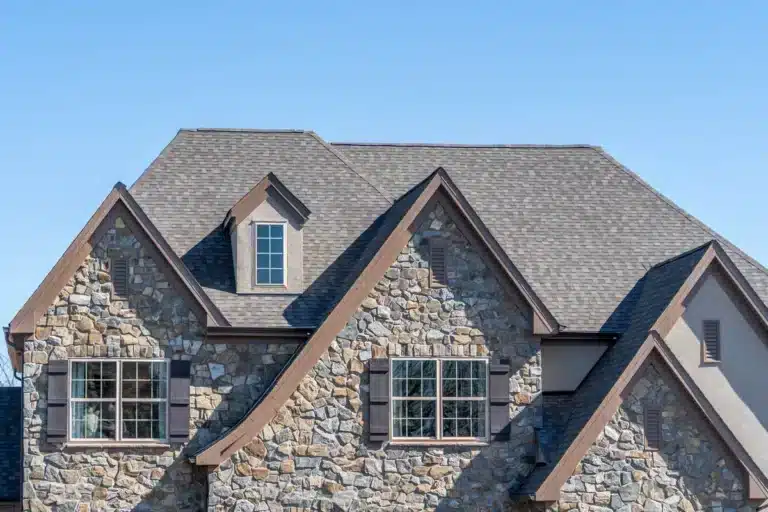 Brick home in Ohio with new roof shingles installed