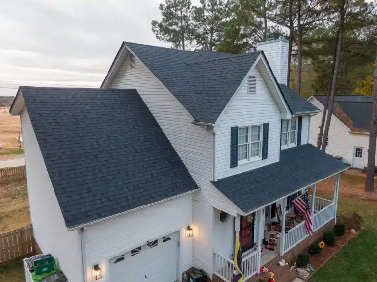 White house with dark shingle colors installed on roof