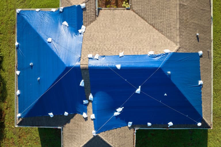 Roof covered with cloth for temporary shade or protection.
